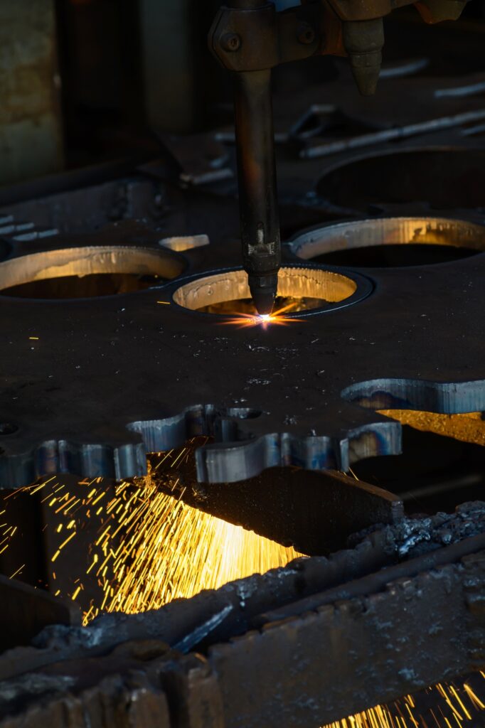 Laser cutting welding flat sheet metal steel material with sparks